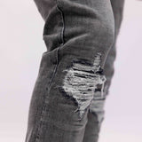 DISTRESSED FLARED JEANS